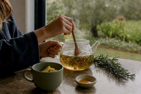 Pouring herbal tea for caffeine-free energy