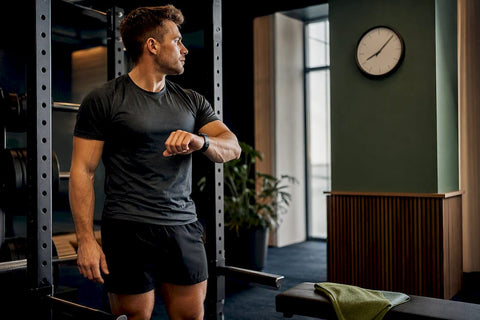 Lifter checking timing before strength workout