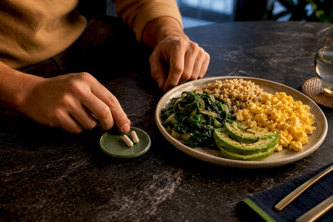 Anonymous supplements beside a balanced meal