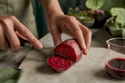 Red cactus fruit beside concentrated extract