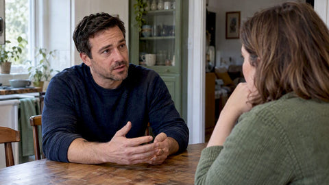 Couple talking about performance anxiety at home